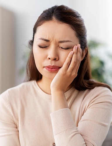 Patient experiencing toothache at home