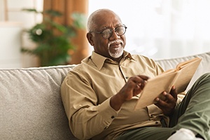 A man resting after dental implant surgery