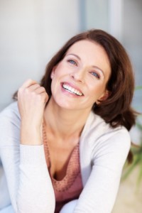Woman with a beautiful smile thanks to the summerlin dentist you can rely on Dr. West