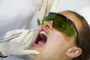 Woman at dentist for laser gum recontouring