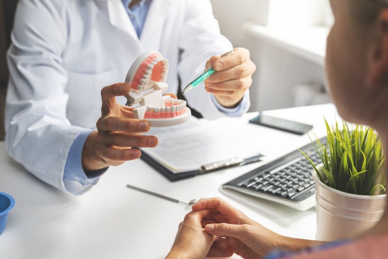 dentist talking during dental implant consultation