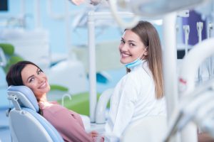 Woman at dentist for veneer replacement