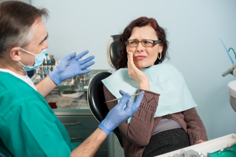 A woman facing a strange dental emergency