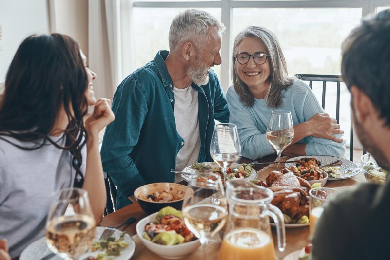 A family enjoying Thanksgiving after Mom's teeth whitening treatment