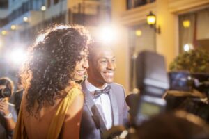 People on the red carpet smiling